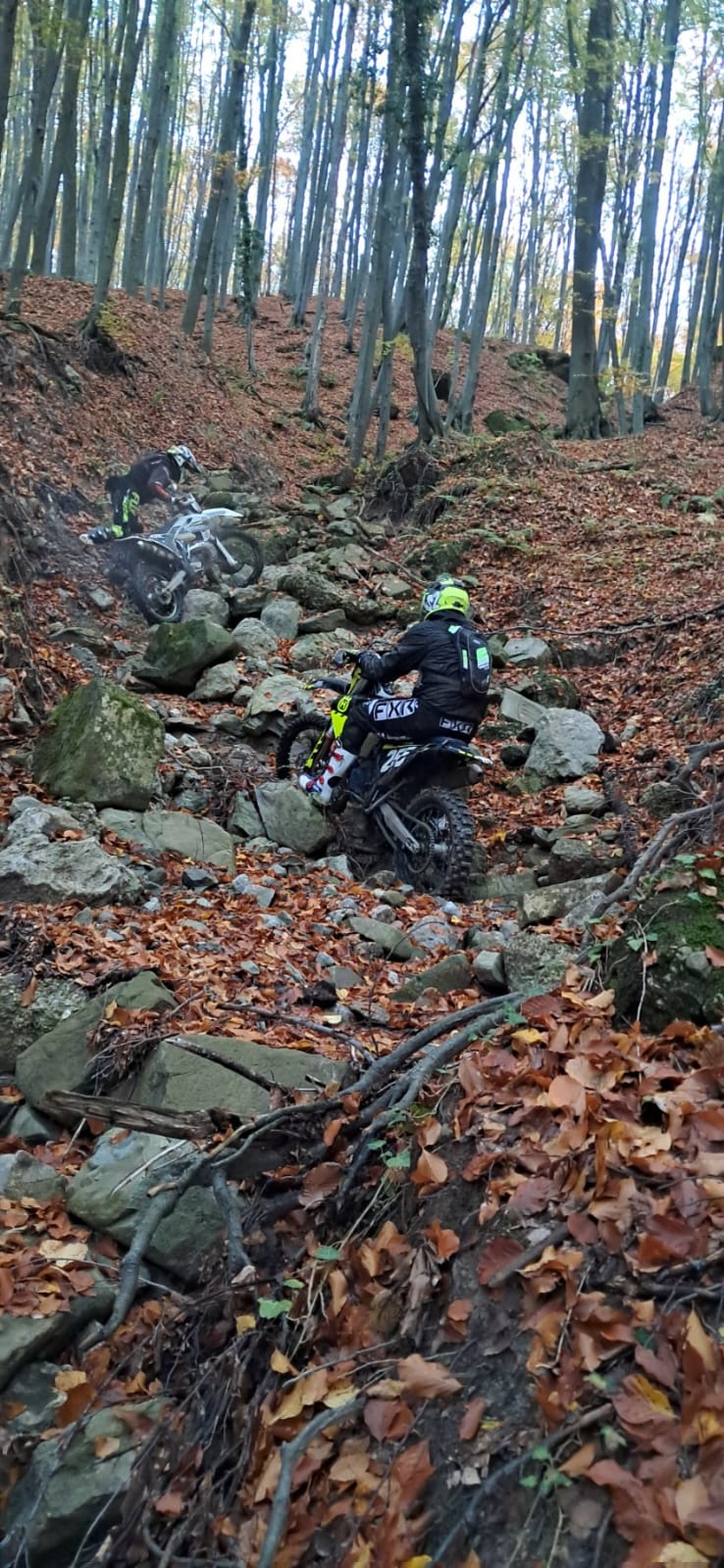 Enduro rider jumping on mountain trail